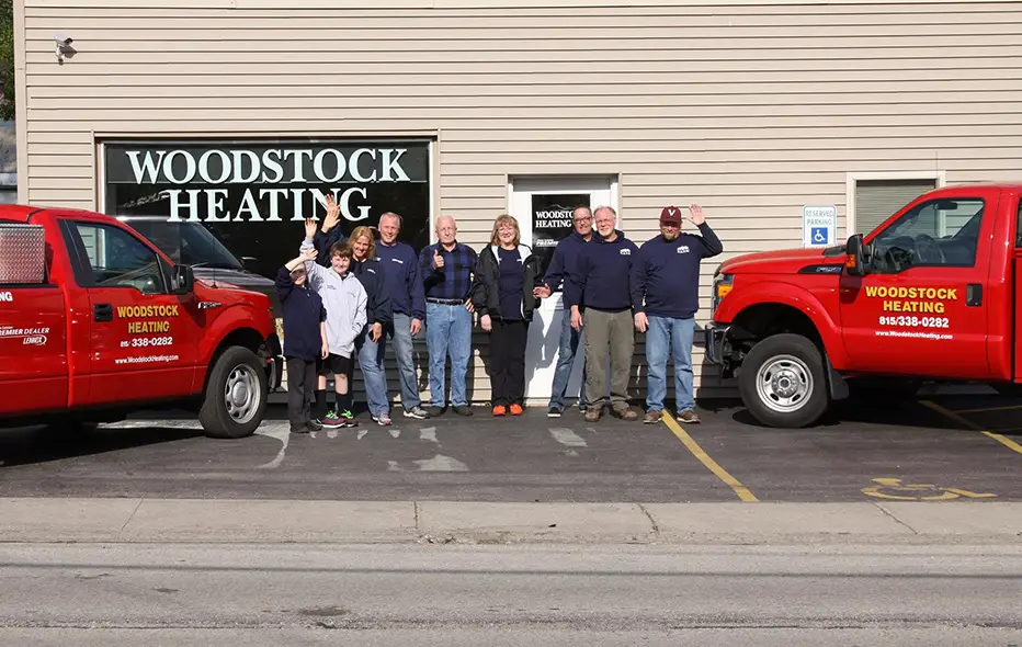 Woodstock's employees are standing in front of their building