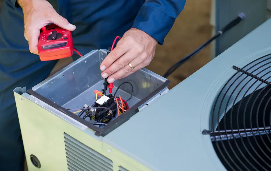 Technician inspecting an AC unit
