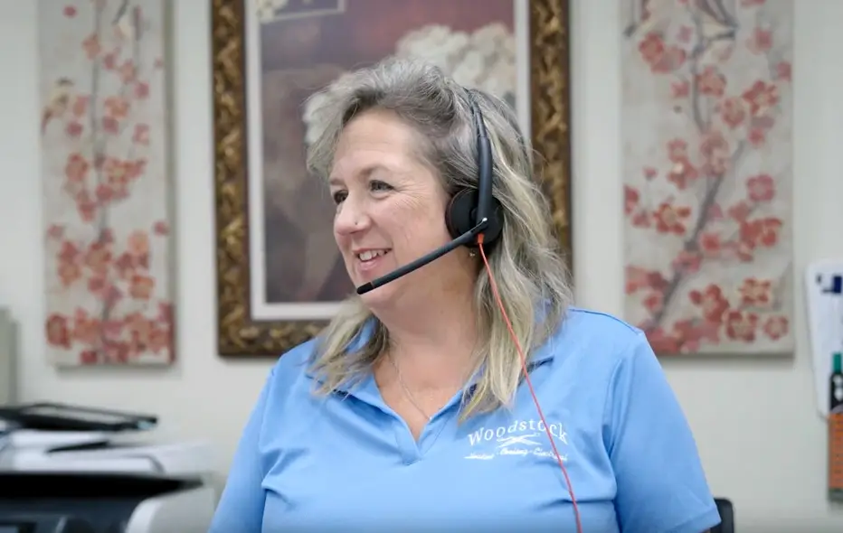 Woodstock employee talking into a headset